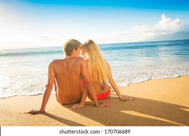 Happy Romantic Couple Watching the Sunset on Tropical Beach Vacation