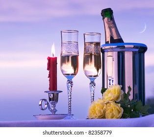 Happy Romantic Dinner With White Wine On The Sky Background