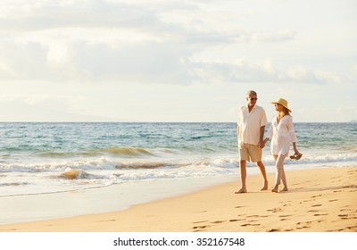 Happy Romantic Middle Aged Couple Enjoying Beautiful Sunset Walk on the Beach. Travel Vacation Retirement Lifestyle Concept - Powered by Shutterstock