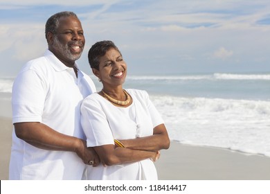Happy romantic senior African American man and woman couple on a deserted tropical beach