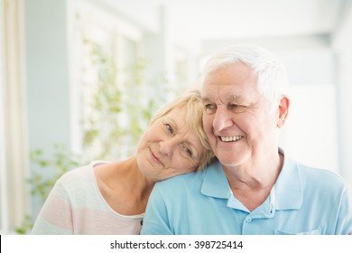 Happy Romantic Senior Couple Smiling At Home