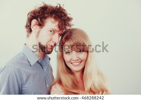 Similar – Young couple posing with funny faces