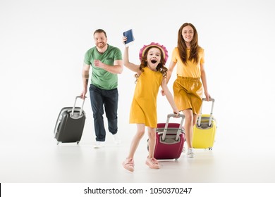 Happy Running Family With Suitcases Isolated On White, Travel Concept