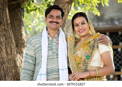 Happy Rural Indian Farmer With His Wife At Village