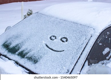 Happy And Sad Smile Emoticon Face In Snow On Car Windows, Winter Season Joy And Happiness Concept