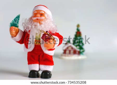 Happy Santa Claus Doll on Christmas time.colorful bokeh background
