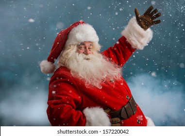 Happy Santa Claus Laughing While Standing Outdoors At North Pole