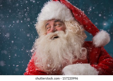 Happy Santa Claus Laughing While Standing Outdoors At North Pole