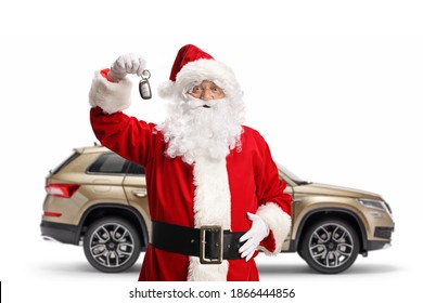 Happy santa Claus with a vehicle showing car keys isolated on white background - Powered by Shutterstock