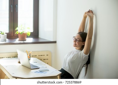 Happy Satisfied Female Manager Stretching Up On Her Chair, Looking In Laptop  Computer. Job Well Done Concept.