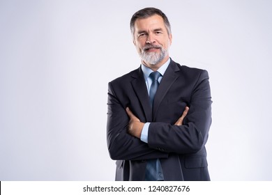 Happy satisfied mature businessman looking at camera isolated on white background - Shutterstock ID 1240827676