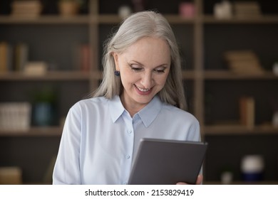 Happy Satisfied Mature Lady Using Online App On Tablet, Virtual Bank Service For Payment, Reading Text On Digital Computer Screen, Browsing Internet, Chatting, Making Video Call