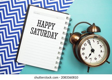 Happy Saturday Text And Alarm Clock On Blue Background