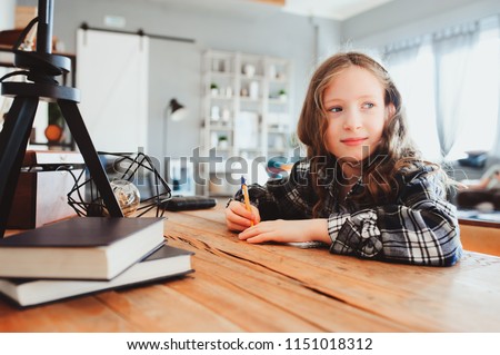 Image, Stock Photo happy school girl doing homework. Smart child working hard