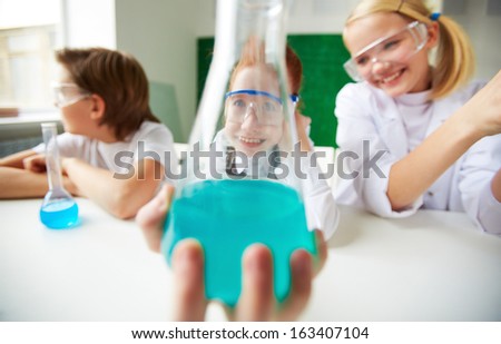 Similar – Image, Stock Photo Happy kid looking liquid through magnifying glass