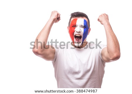 Happy screaming  France football fan of fortune win of the match of France national  team.  Big smile,scream, Hands over head. European  football fans concept.