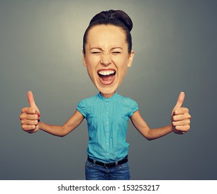 happy screaming girl with big head and big thumbs up - Shutterstock ID 153253217