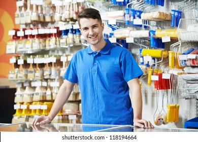 Happy Seller Assistant Man In DIY Hardware Or Home Improvement Store