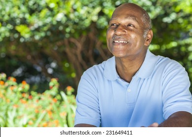 A happy senior African American man in his sixties outside smiling.