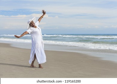 Happy senior African American woman dancing alone on a deserted tropical beach