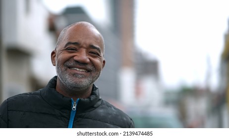 A Happy Senior Black Man Portrait Face Smiling At Camera Standing Outside In Street