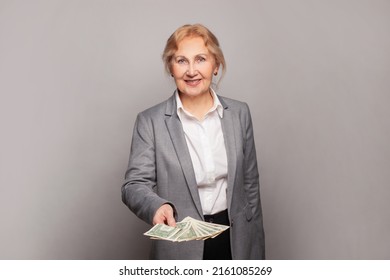 Happy Senior Business Woman Holding Money Us Dollars On Gray Banner Background