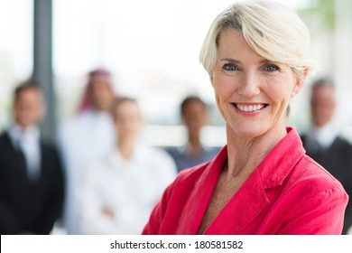 happy senior businesswoman looking at the camera