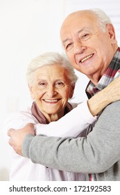 Happy Senior Citizen Couple Dancing Together And Smiling