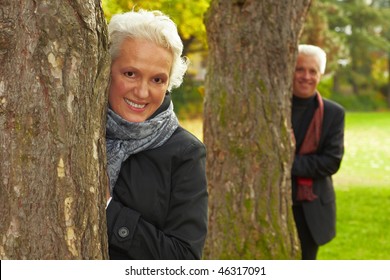 Happy Senior Couple In An Autumn Forest