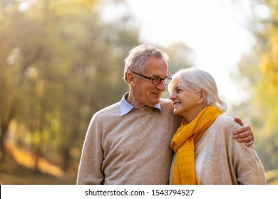 Happy senior couple in autumn park
 - Shutterstock ID 1543794527