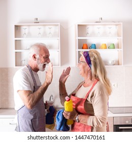 Happy senior couple celebrating finished chores and house cleaning  - Powered by Shutterstock