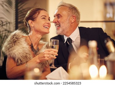 Happy, senior and couple celebration dinner with wine glass and smile of woman with funny man. New years party with mature guests smiling together for joke in elegant, classy and formal style. - Powered by Shutterstock