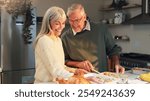 Happy, senior couple or cooking for thanksgiving, food or festive holiday in home for love. Retirement, salad or elderly people with smile, care or lunch for dinner party, meal prep or feast together