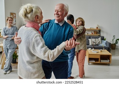 Happy senior couple dancing together - Powered by Shutterstock