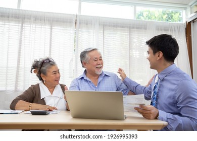 Happy Senior Couple During The Meeting With Agent Or Financial Advisor Consultant, Southeast Asian Elderly Model