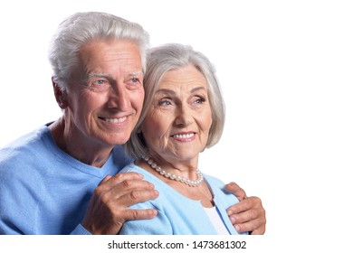 Happy Senior Couple Embracing And Posing On White Background