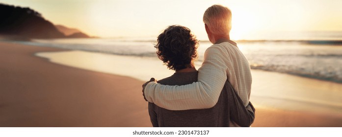 A happy senior couple enjoys their golden years, watching a breathtaking beach sunset together. Embodying the essence of retirement and relaxation, they share quality time and savor the good life. - Powered by Shutterstock