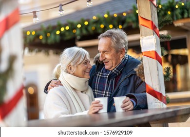 Happy senior couple having fun on the Christmas Market
 - Powered by Shutterstock