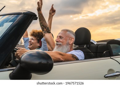 Happy Senior Couple Having Fun Driving On New Convertible Car - Mature People Enjoying Time Together During Road Trip Tour Vacation - Travel People Lifestyle Concept