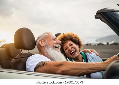 Happy Senior Couple Having Fun Driving On New Convertible Car - Mature People Enjoying Time Together During Road Trip Tour Vacation - Elderly Lifestyle And Travel Culture Transportation Concept