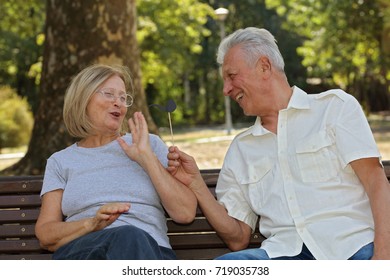 Happy Senior Couple Having Fun Outdoors . Active Senior Lifestyle, Never Too Old For Being Silly