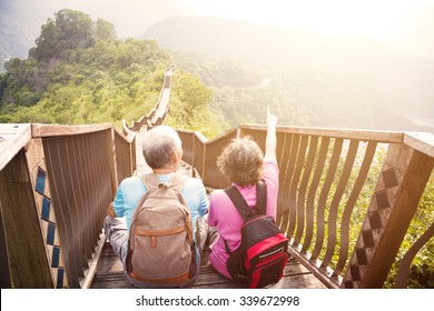 Happy   Senior Couple Hiking On The Mountain 