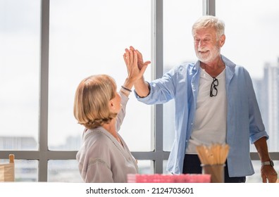 Happy Senior Couple In Living Room, Older Couple Giving High Five, Happiness Family And Retirement Concepts