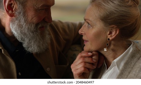 Happy Senior Couple Looking Each Other Indoors. Closeup Smiling Old Aged People Talking Inside. Romantic Elderly Family Spending Time Together Home. Love Old Marriage Family Relationship Concept