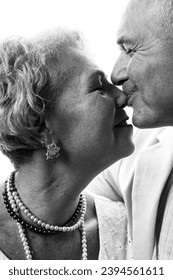 Happy senior couple in love. Close-up portrait in studio. - Shutterstock ID 2394561611