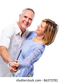 Happy senior couple in love dancing. Isolated over white background.
