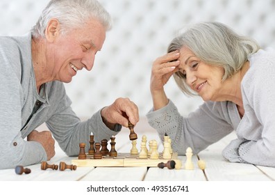 Happy Senior Couple Playing Chess