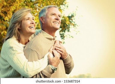 Happy senior couple relaxing in the park. - Powered by Shutterstock