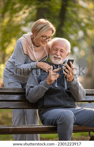 Similar – Image, Stock Photo Senior couple sitting on sofa at home having a relationship problems