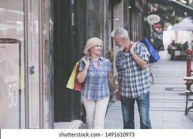 Happy Senior Couple With Shopping Bags